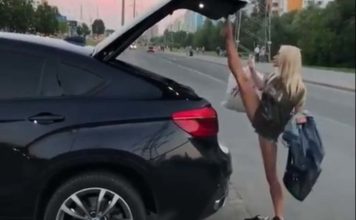 Блондинка необычным способом закрыла багажник авто: видео удивило Сеть